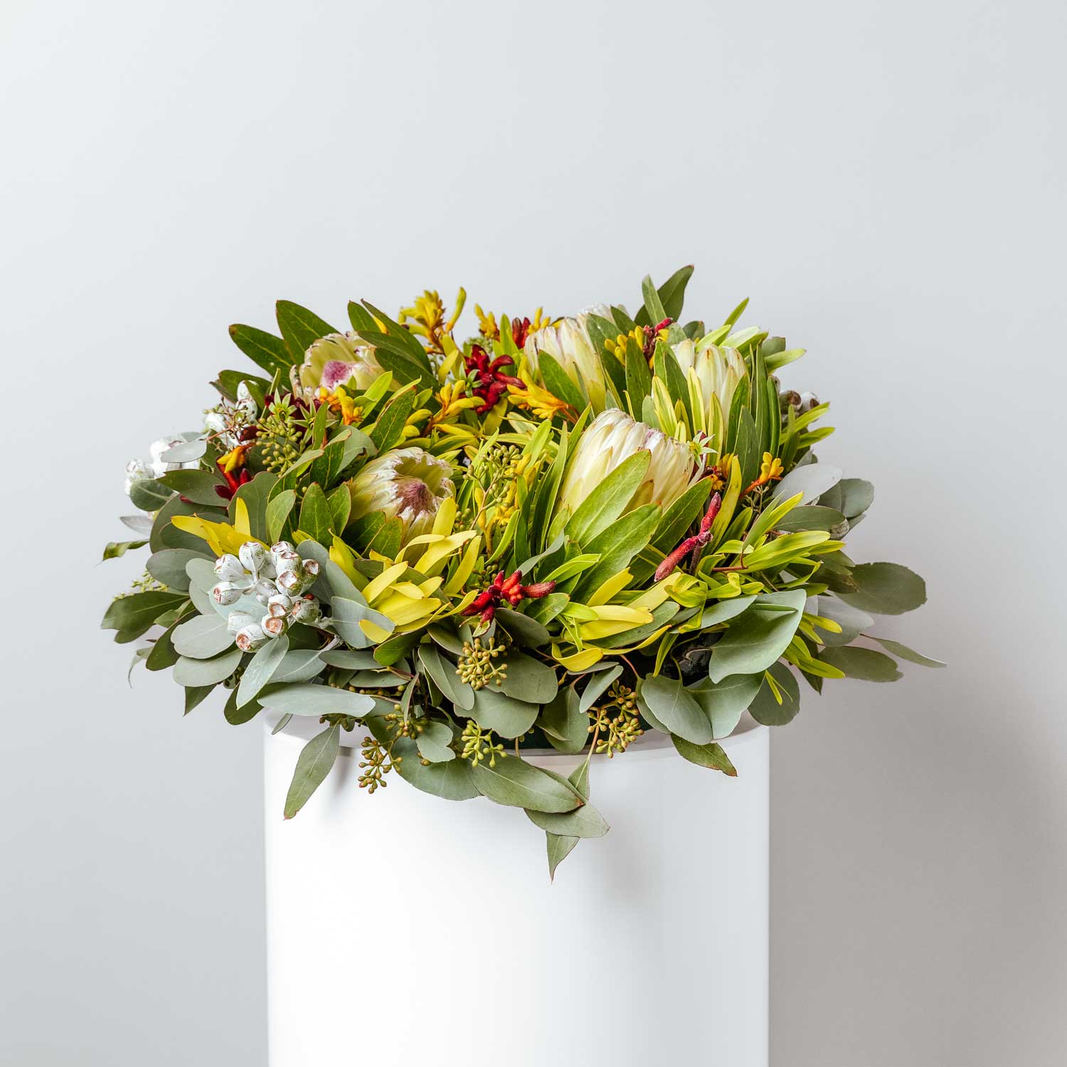 funeral wreath made with seasonal native flowers including protea kangaroo paw leucadendron gumnuts and foliage created into a circular shape