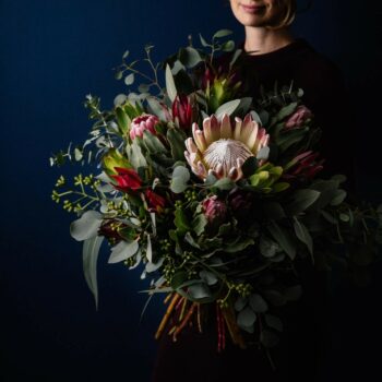 large bouquet created with seasonal native flowers including king protea leucadendron protea gum nuts and eucalyptus foliage