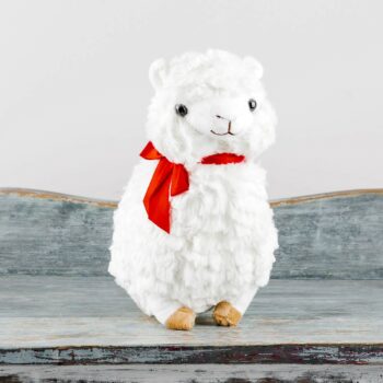 soft plush white small llama with red ribbon around neck