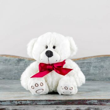 soft plush white small teddy bear with red ribbon around neck