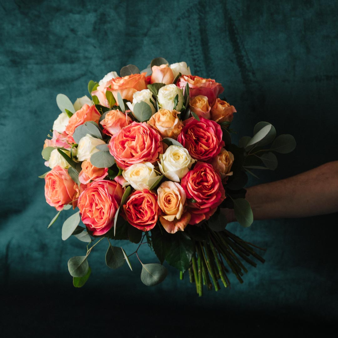 Rose bouquet with locally grown yellow orange roses and soft green foliage